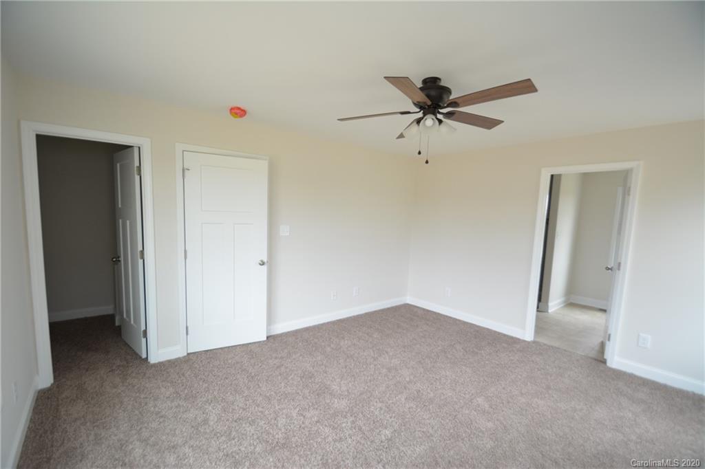 1311 George Brown Road Crouse, NC 28033 - Photo 18 of 32 a view of a livingroom with a ceiling fan and carpet