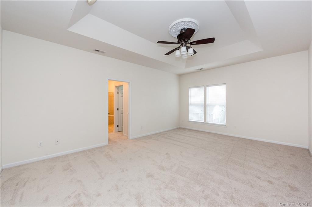 7810 Greylock Ridge Road Matthews, NC 28105 - Photo 20 of 31 a view of an empty room with a window