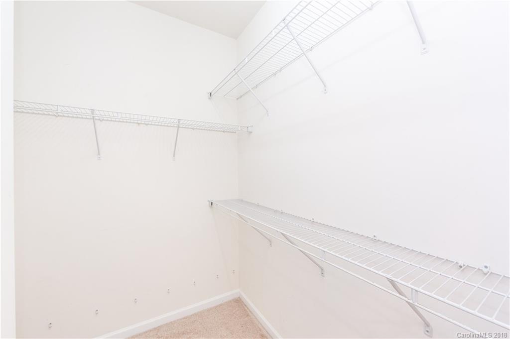 7810 Greylock Ridge Road Matthews, NC 28105 - Photo 23 of 31 a view of small space with racks on the wall