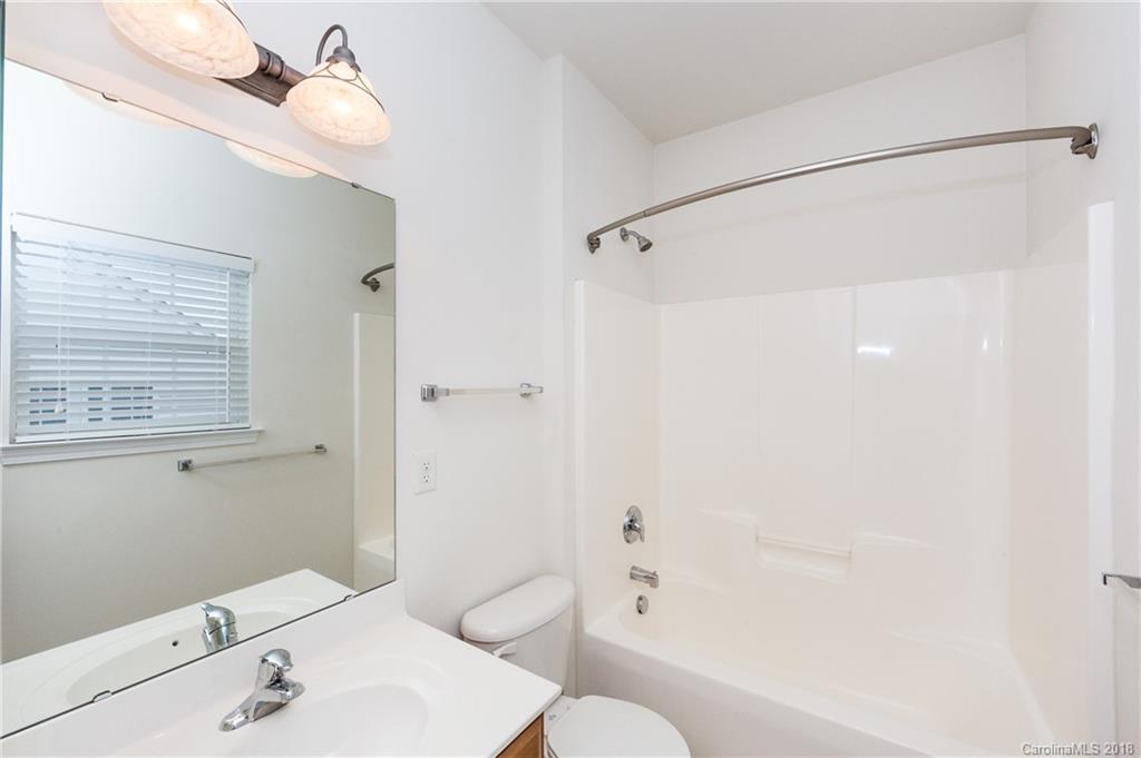 7810 Greylock Ridge Road Matthews, NC 28105 - Photo 28 of 31 a bathroom with a sink a toilet and shower