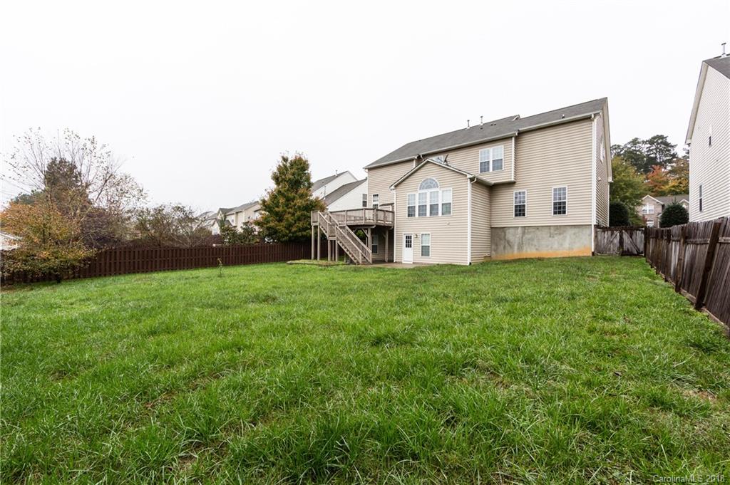 7810 Greylock Ridge Road Matthews, NC 28105 - Photo 29 of 31 a view of a house with a big yard and large tree