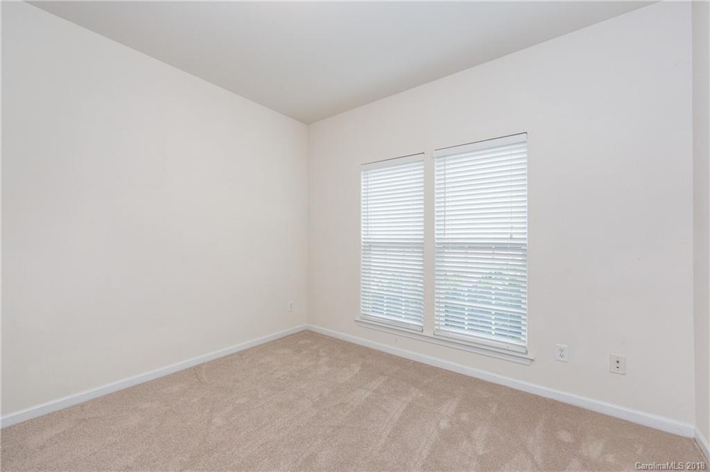 7810 Greylock Ridge Road Matthews, NC 28105 - Photo 10 of 31 an empty room with a window