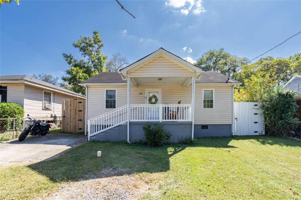 524 King Street Rome, GA 30161 - Photo 1 of 1 a view of a house with a backyard and a patio