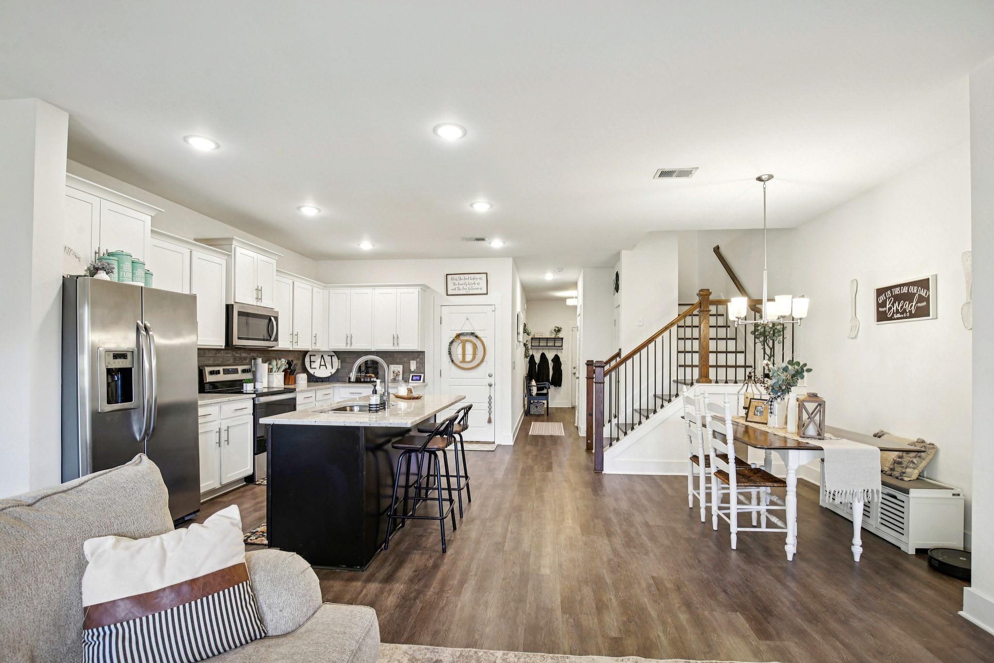 513 Baxter Crossing Lebanon, TN 37087 - Photo 11 of 74 a living room with stainless steel appliances kitchen island granite countertop furniture and a wooden floor