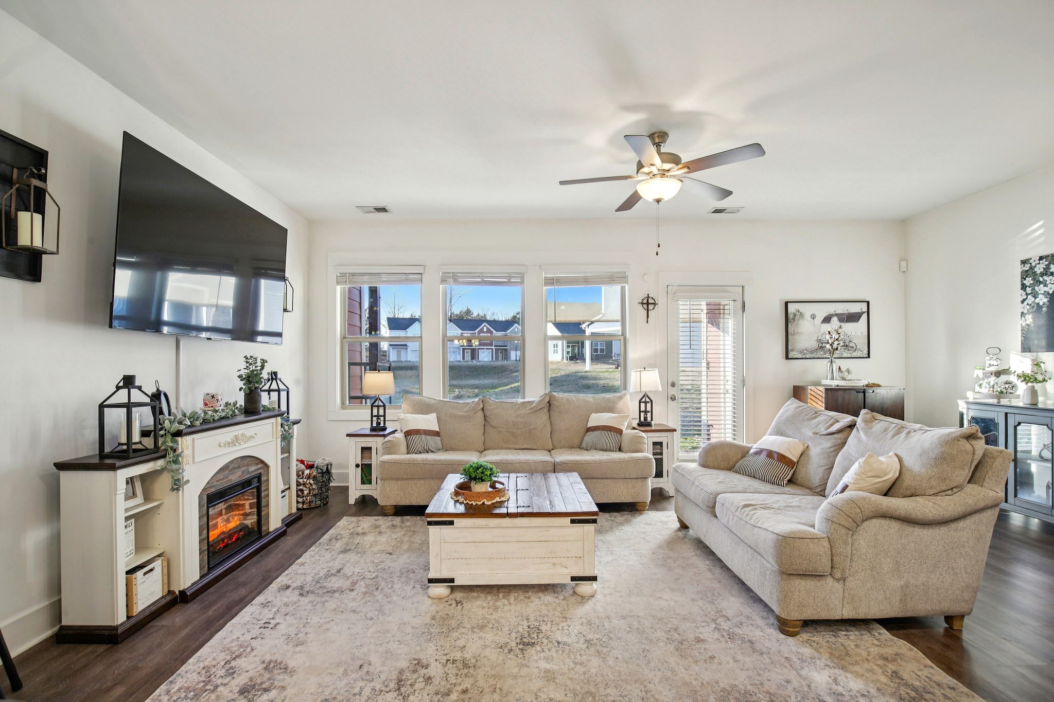 513 Baxter Crossing Lebanon, TN 37087 - Photo 22 of 74 a living room with furniture a flat screen tv and a fireplace