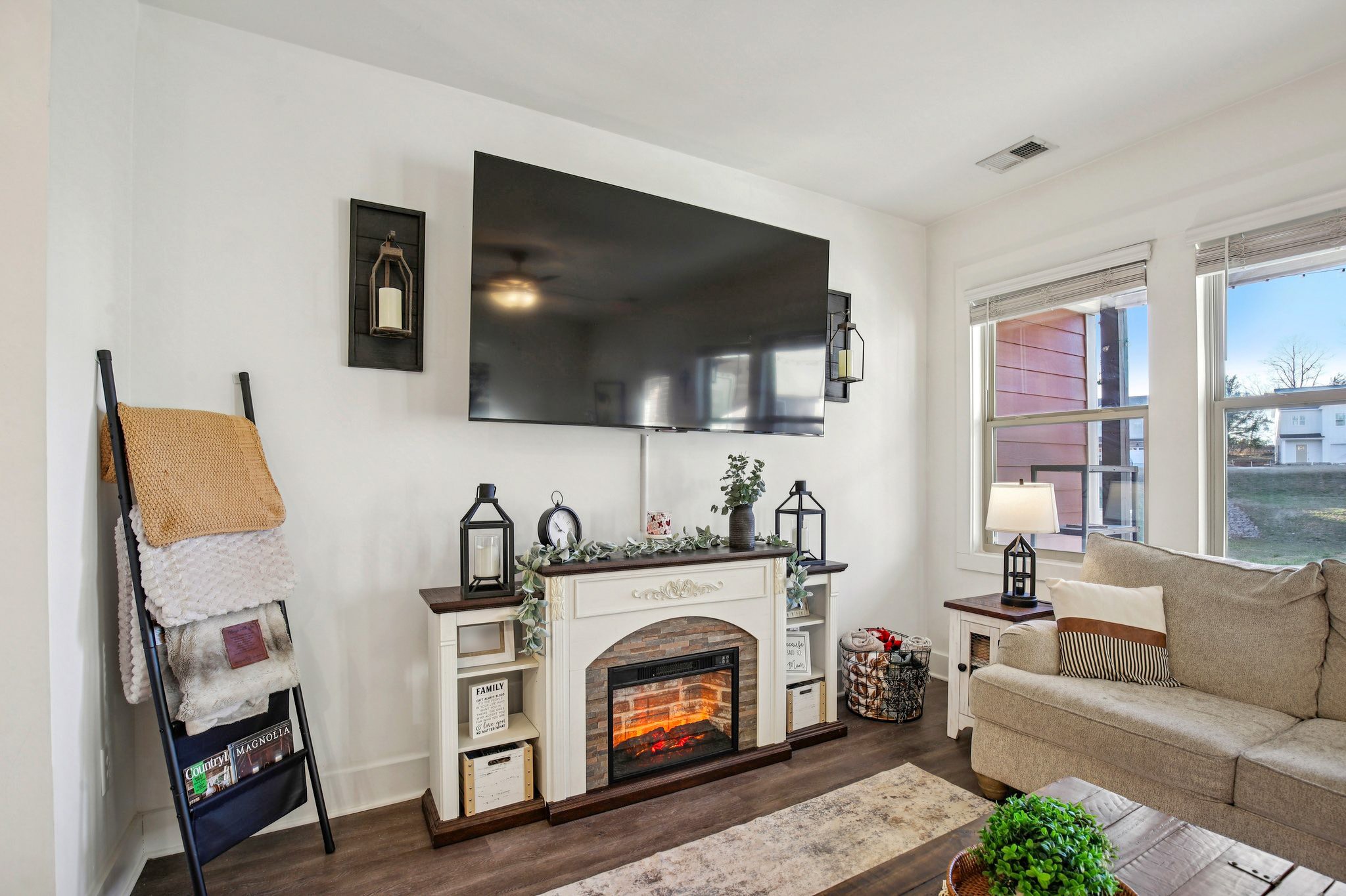 513 Baxter Crossing Lebanon, TN 37087 - Photo 24 of 74 a living room with furniture a flat screen tv and a fireplace