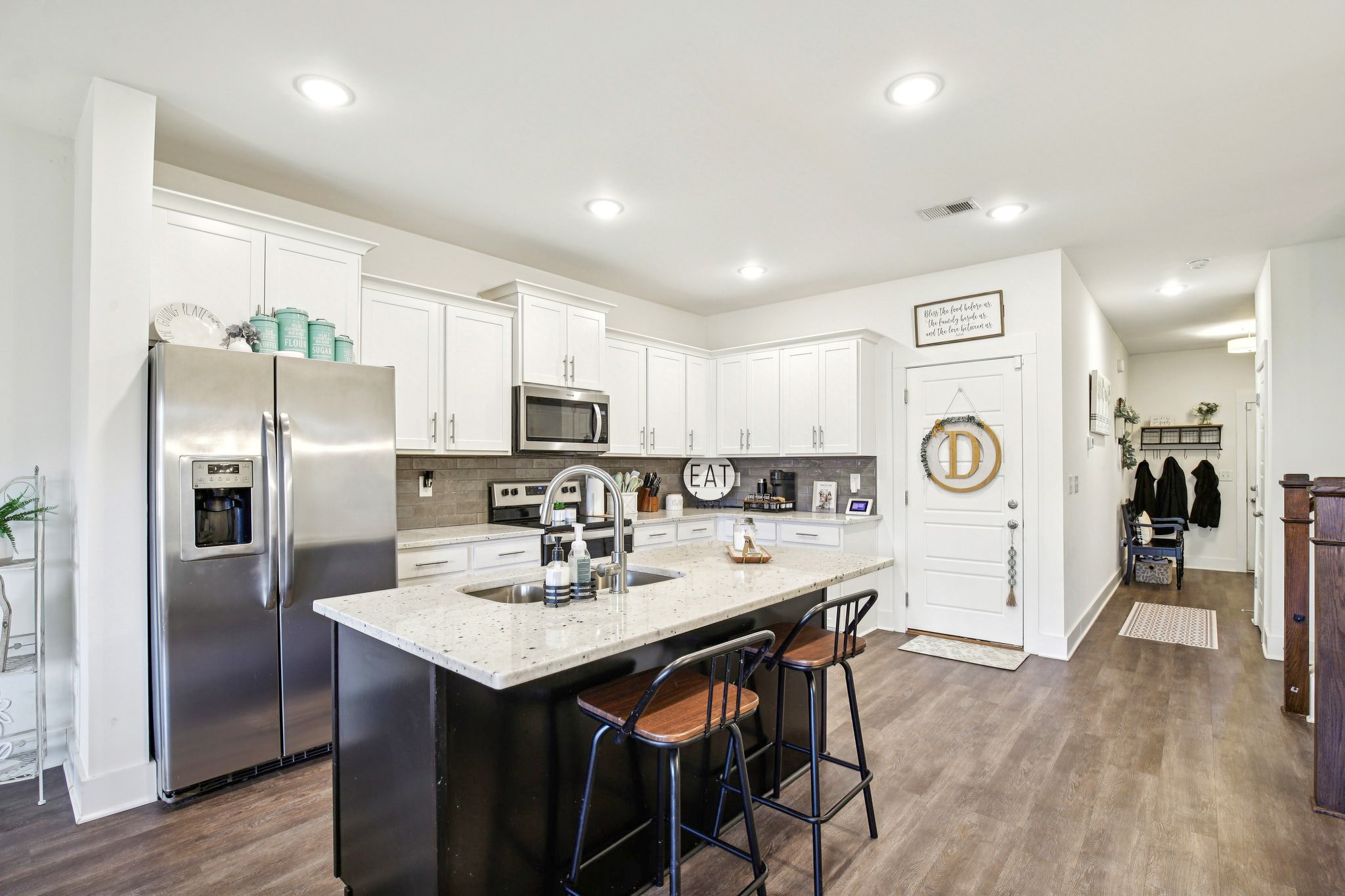 513 Baxter Crossing Lebanon, TN 37087 - Photo 28 of 74 a kitchen with stainless steel appliances a refrigerator stove microwave and cabinets