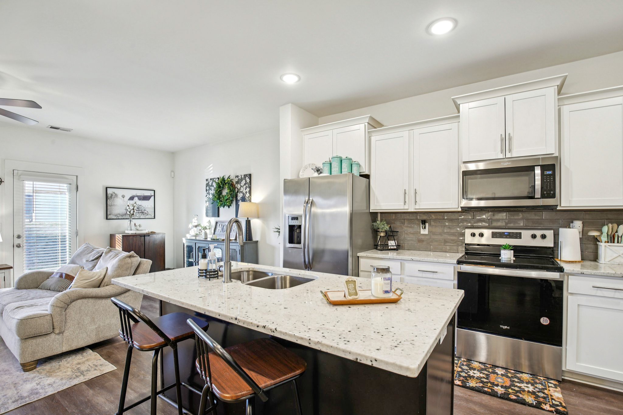 513 Baxter Crossing Lebanon, TN 37087 - Photo 5 of 74 a kitchen with stainless steel appliances kitchen island granite countertop a dining table and chairs