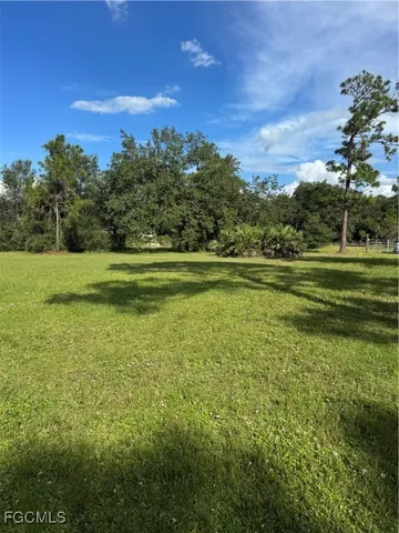 a view of a golf course with a lake