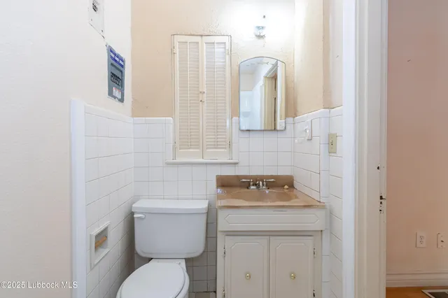 a view of a hallway with wooden floor and entryway