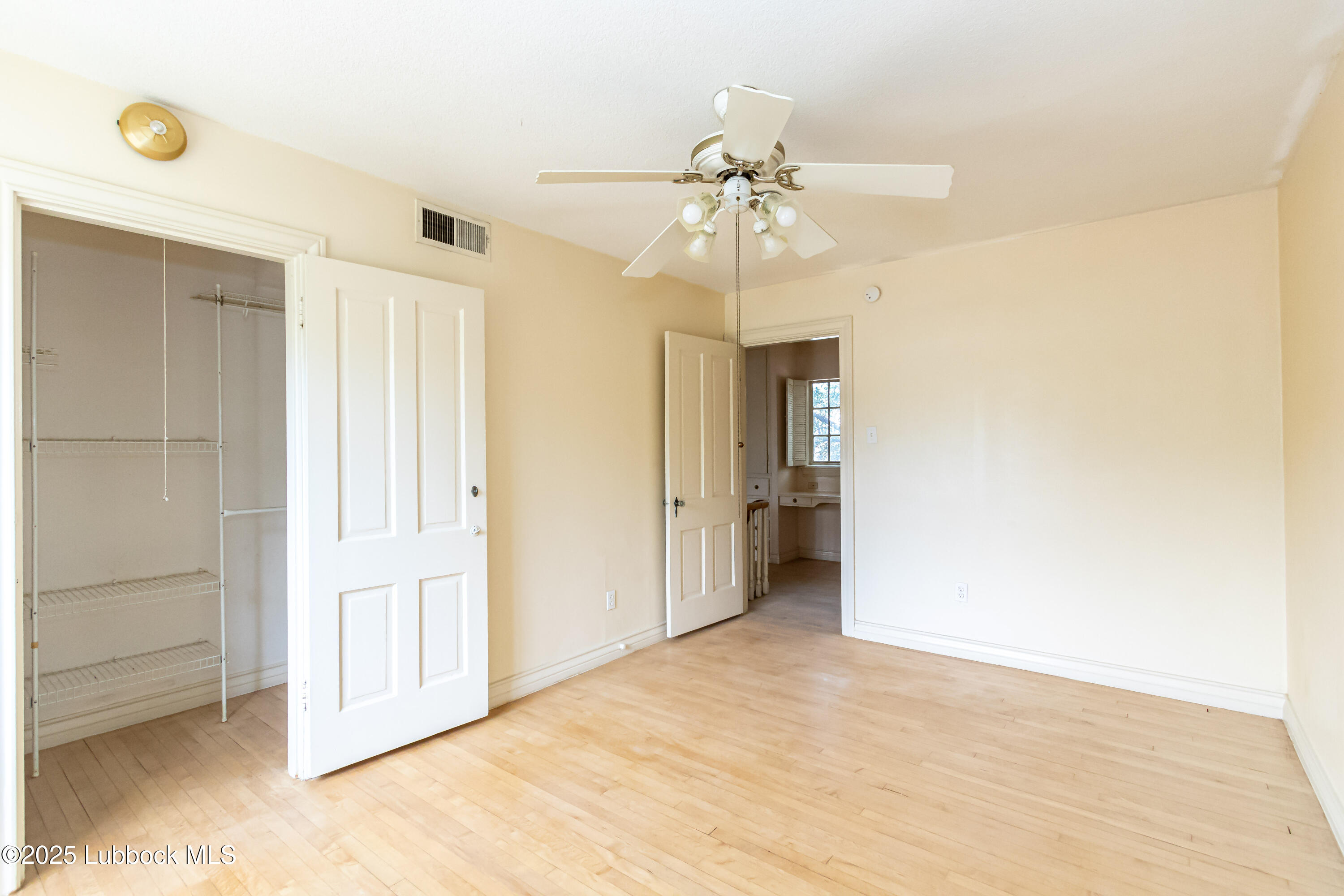 2324 17th Street Lubbock, TX 79401 - Photo 25 of 34 a view of an empty room and chandelier fan