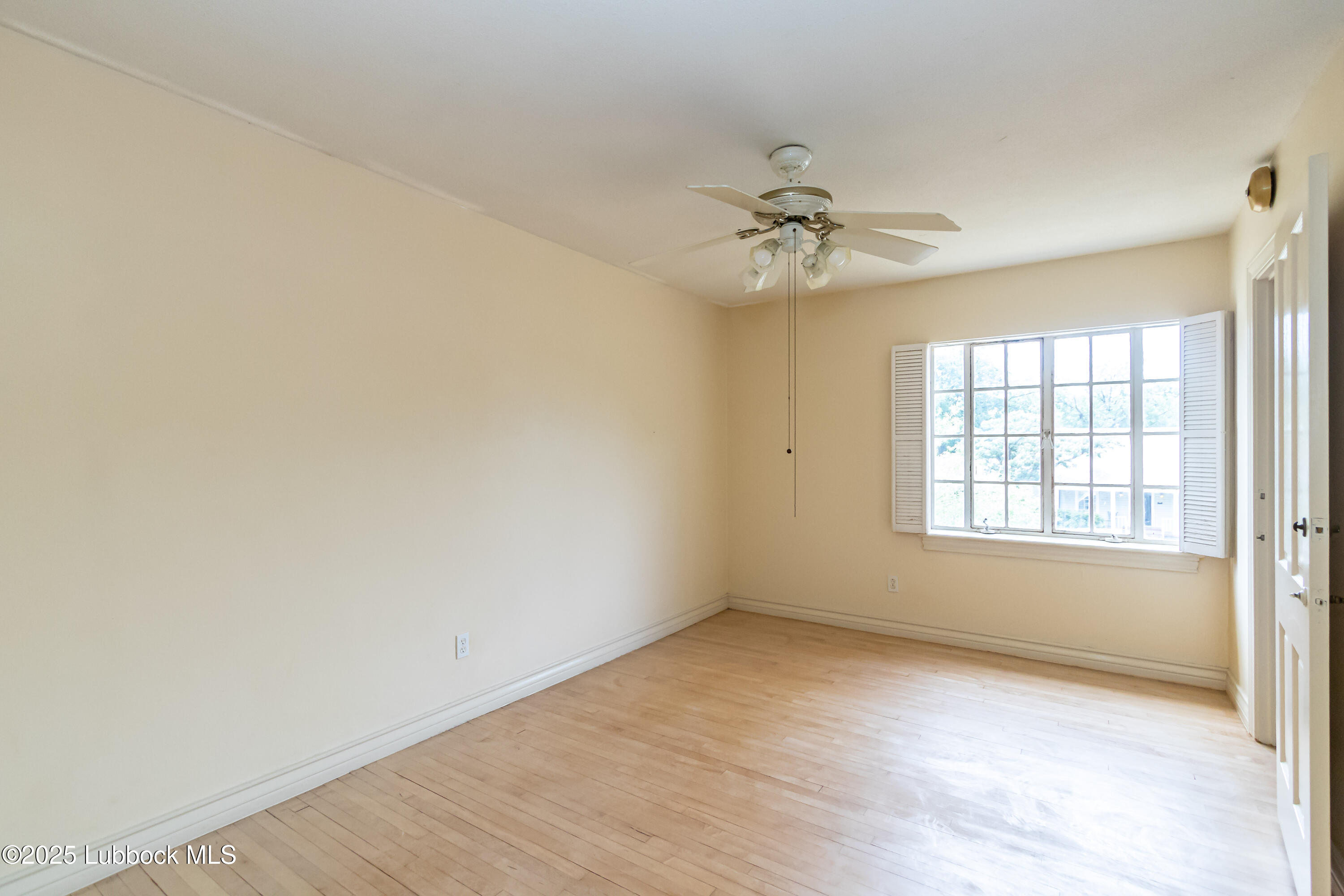 2324 17th Street Lubbock, TX 79401 - Photo 26 of 34 wooden floor in an empty room with a window