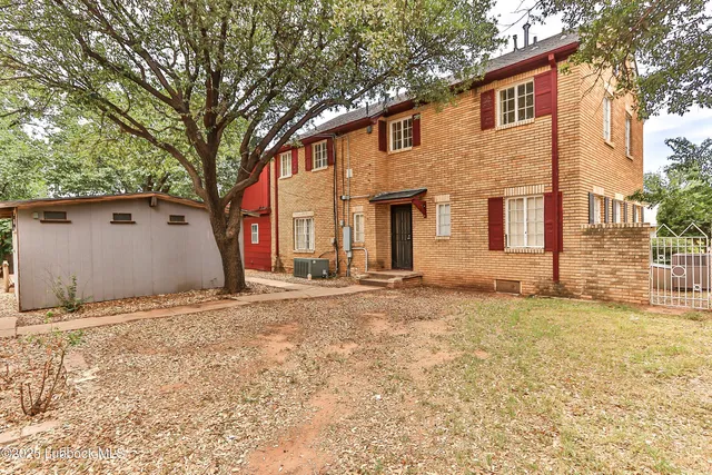 a house with trees in front of it