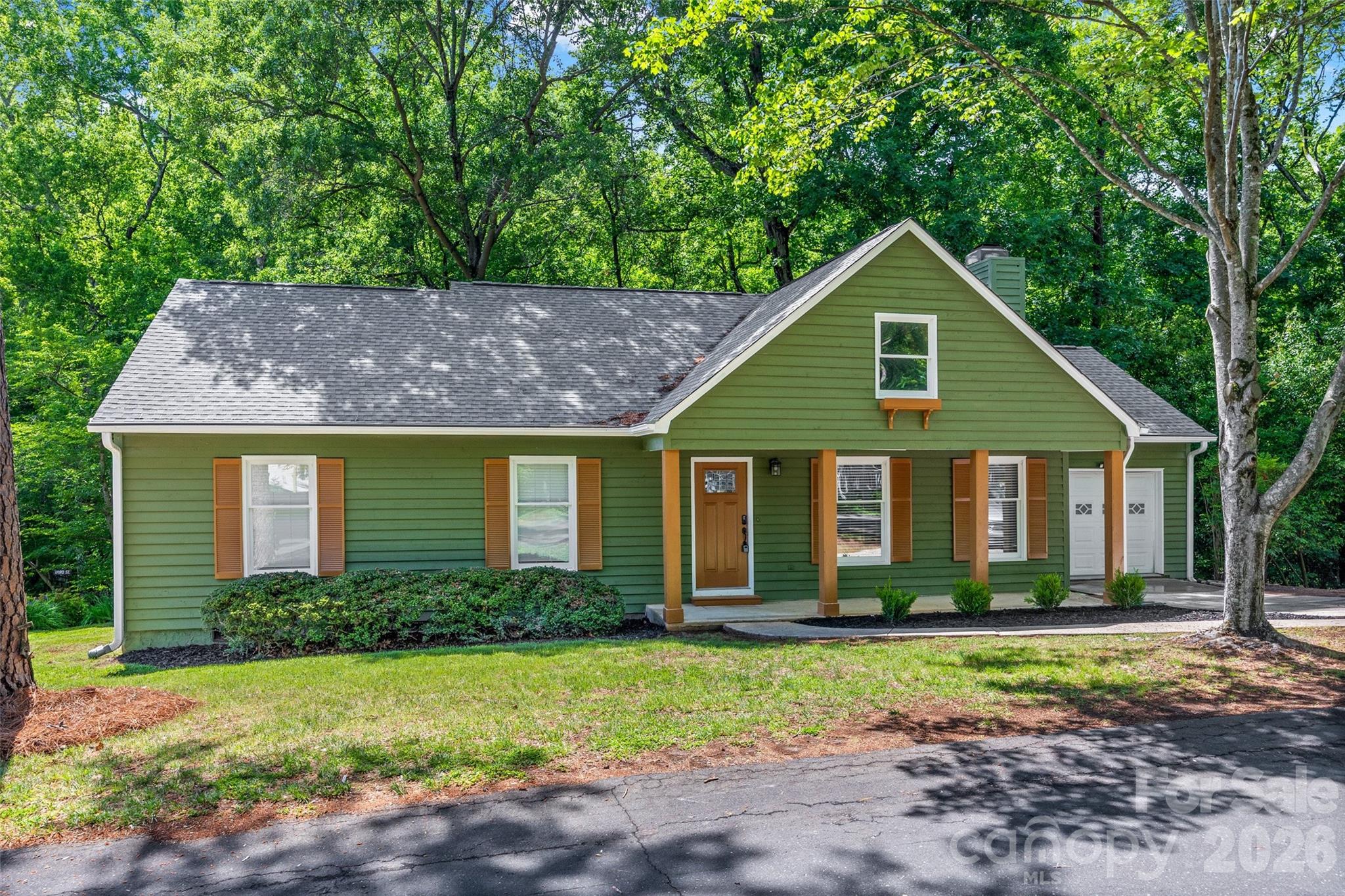 5043 Suwarrow Circle Tega Cay, SC 29708 - Photo 1 of 22 a front view of house with yard and trees