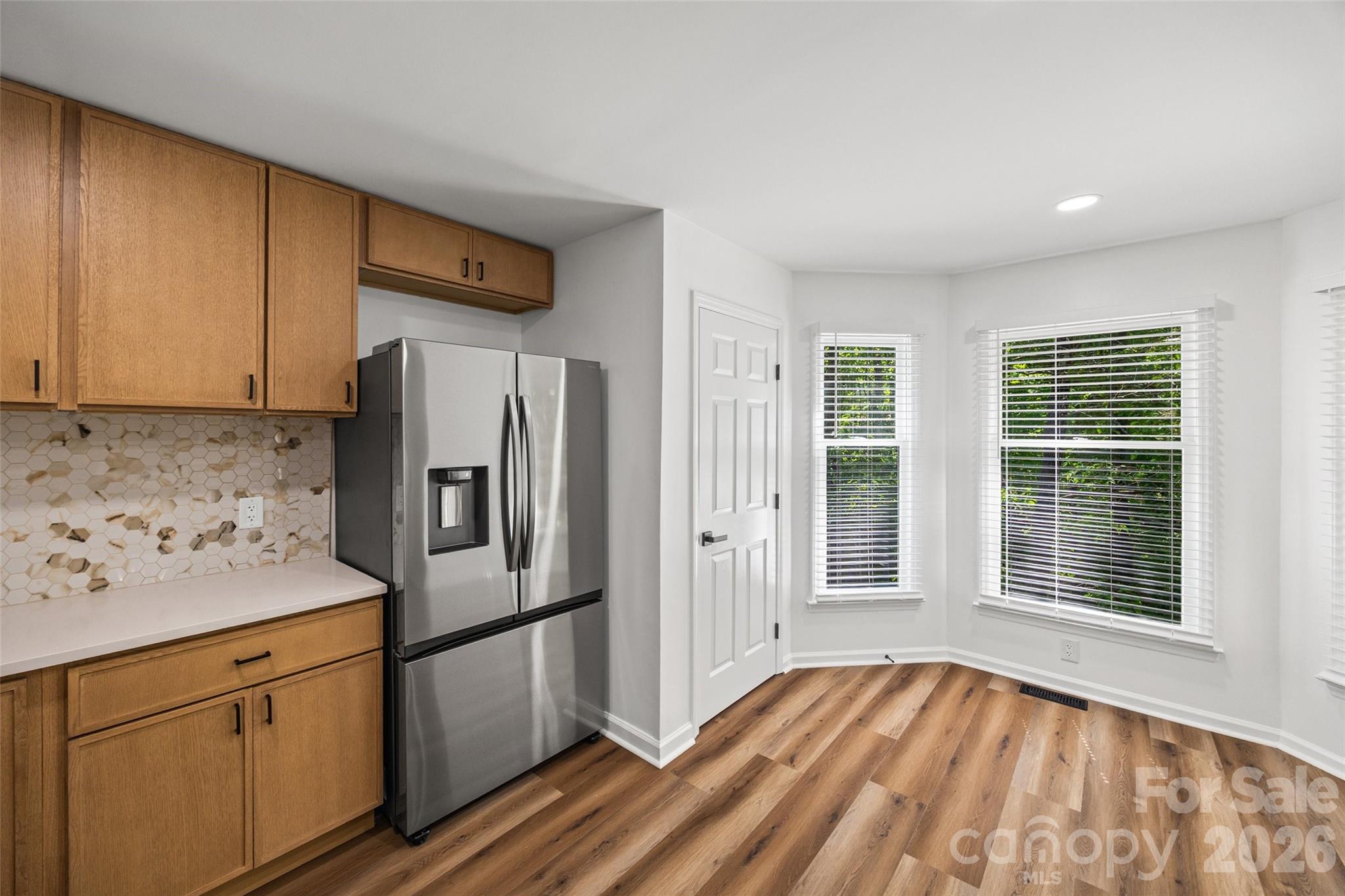 5043 Suwarrow Circle Tega Cay, SC 29708 - Photo 11 of 22 a kitchen with stainless steel appliances granite countertop a refrigerator and a sink