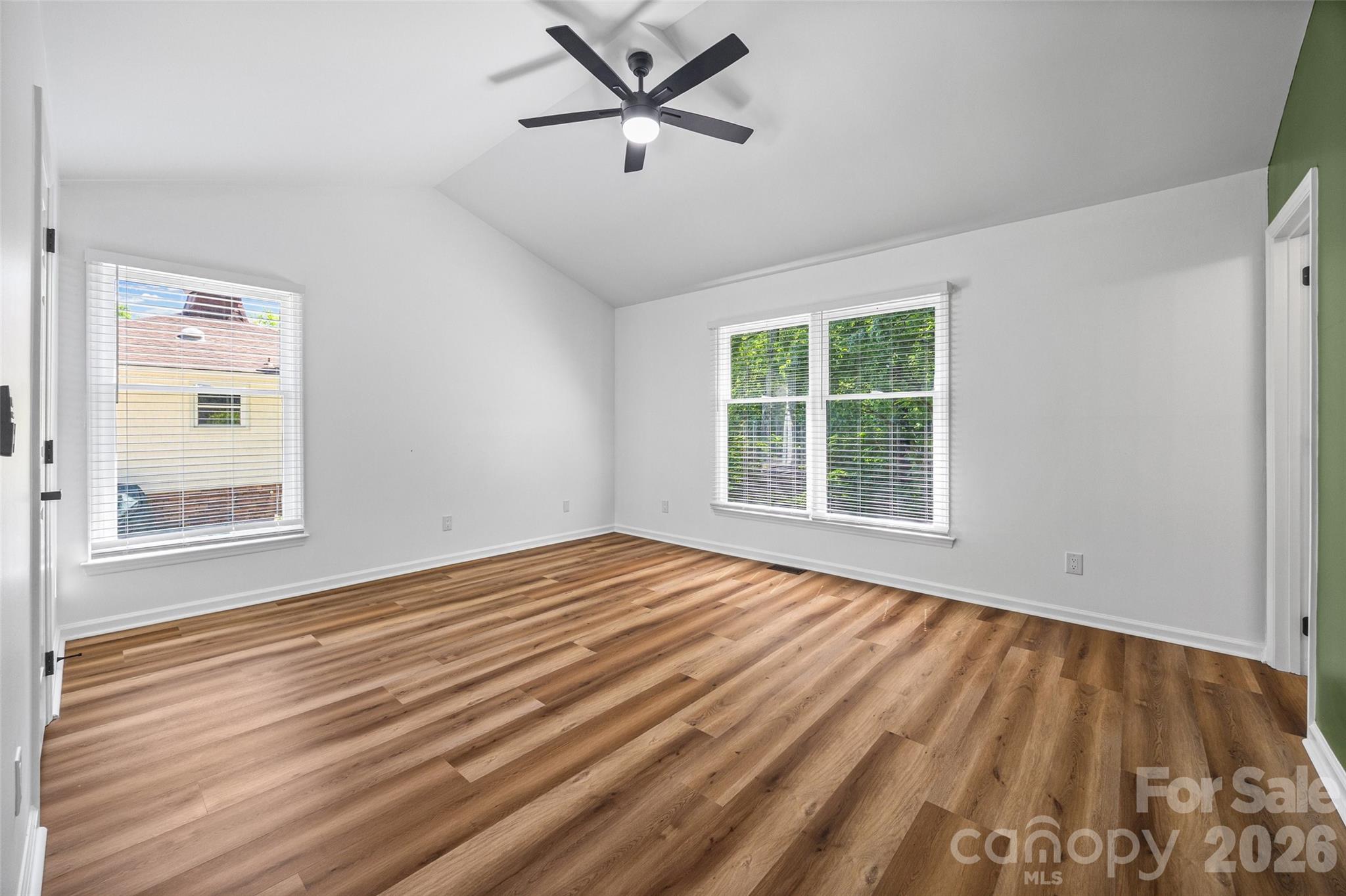 5043 Suwarrow Circle Tega Cay, SC 29708 - Photo 14 of 22 a view of empty room with wooden floor and fan