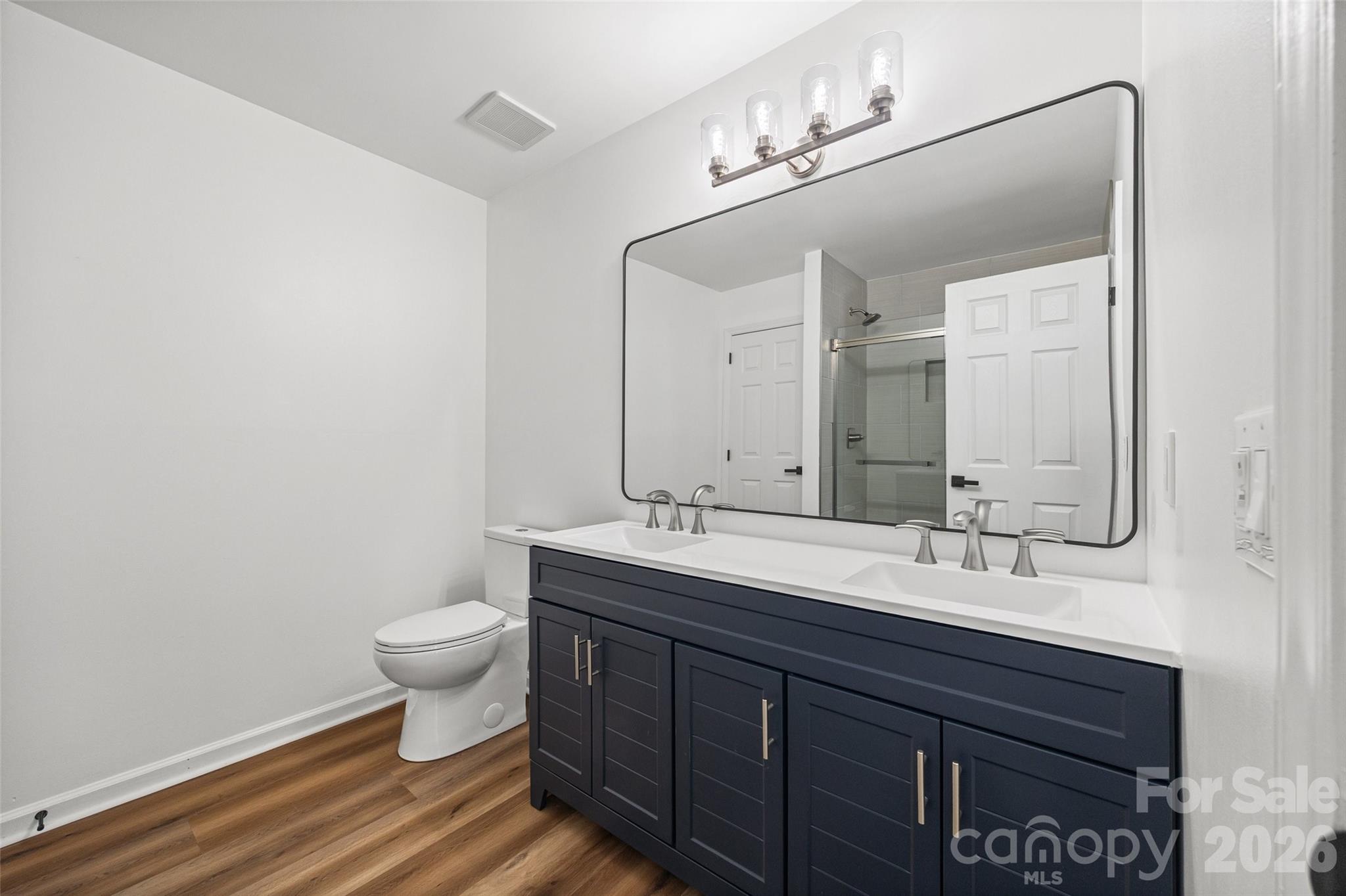 5043 Suwarrow Circle Tega Cay, SC 29708 - Photo 15 of 22 a bathroom with a sink and a mirror
