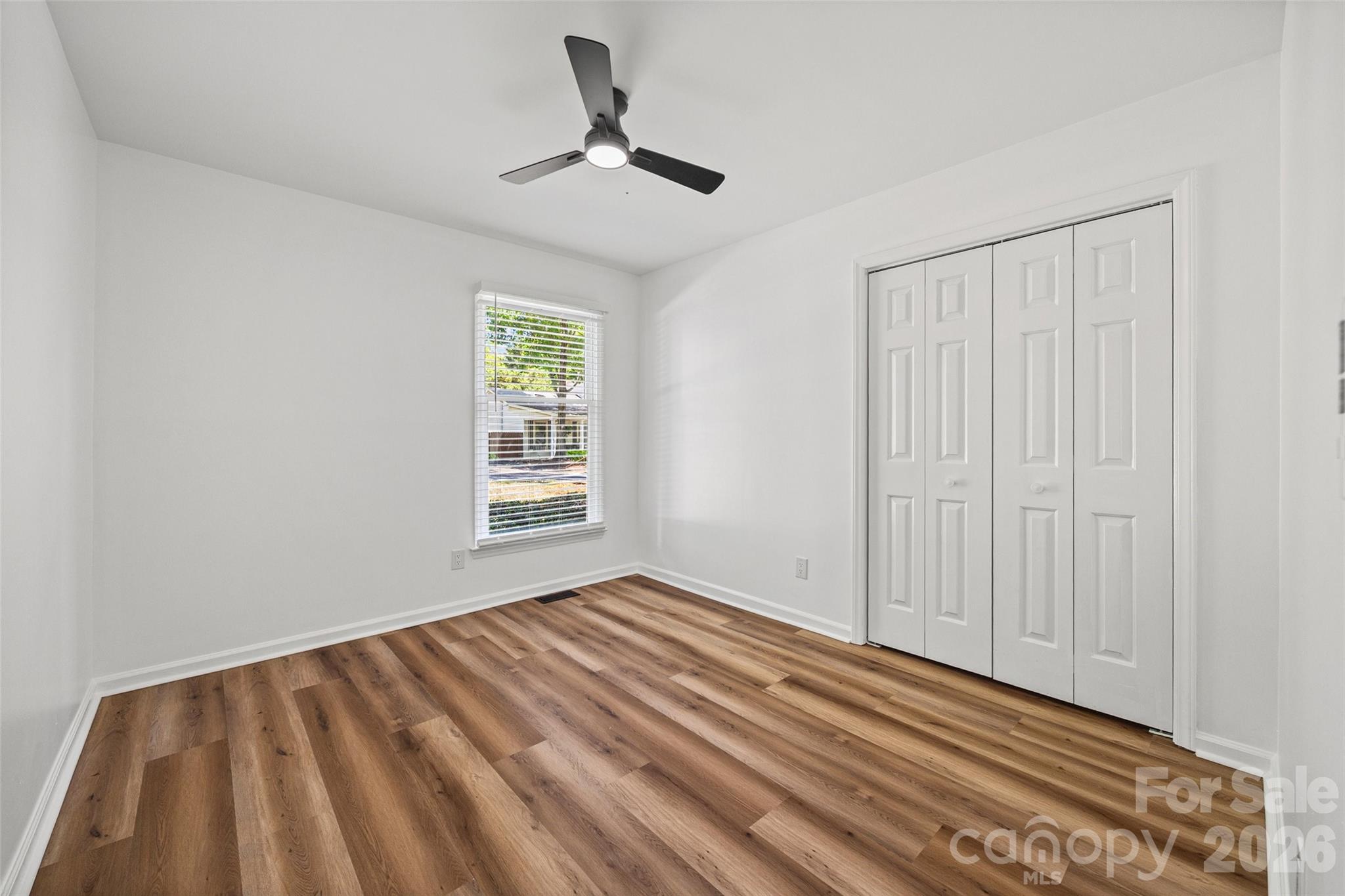 5043 Suwarrow Circle Tega Cay, SC 29708 - Photo 17 of 22 a view of empty room with window and ceiling fan