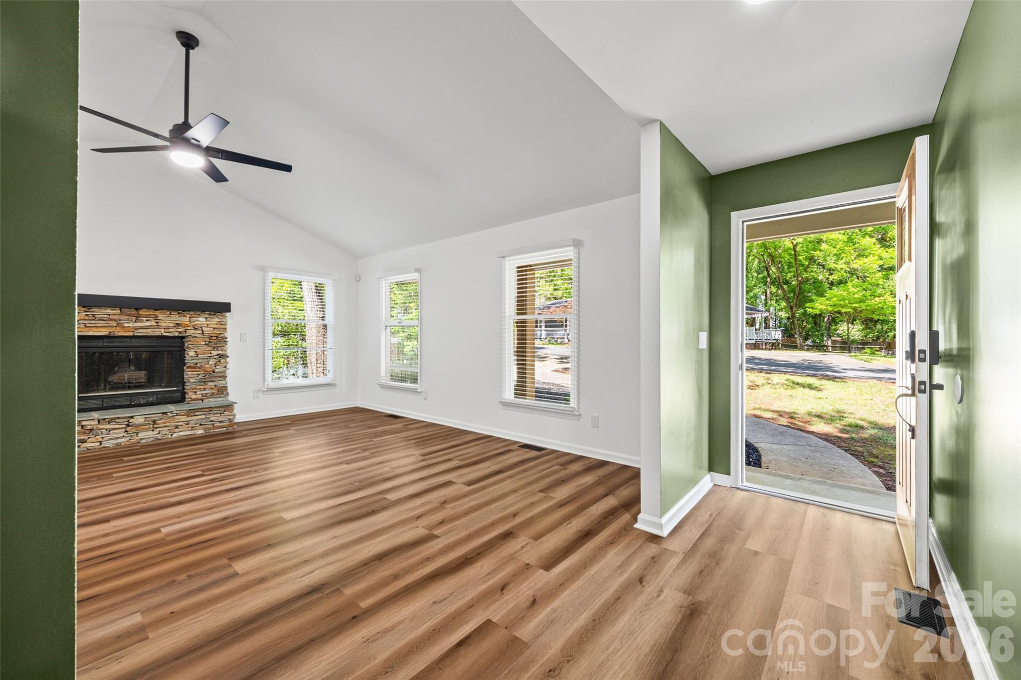 5043 Suwarrow Circle Tega Cay, SC 29708 - Photo 2 of 22 a view of an empty room with a fireplace and a window