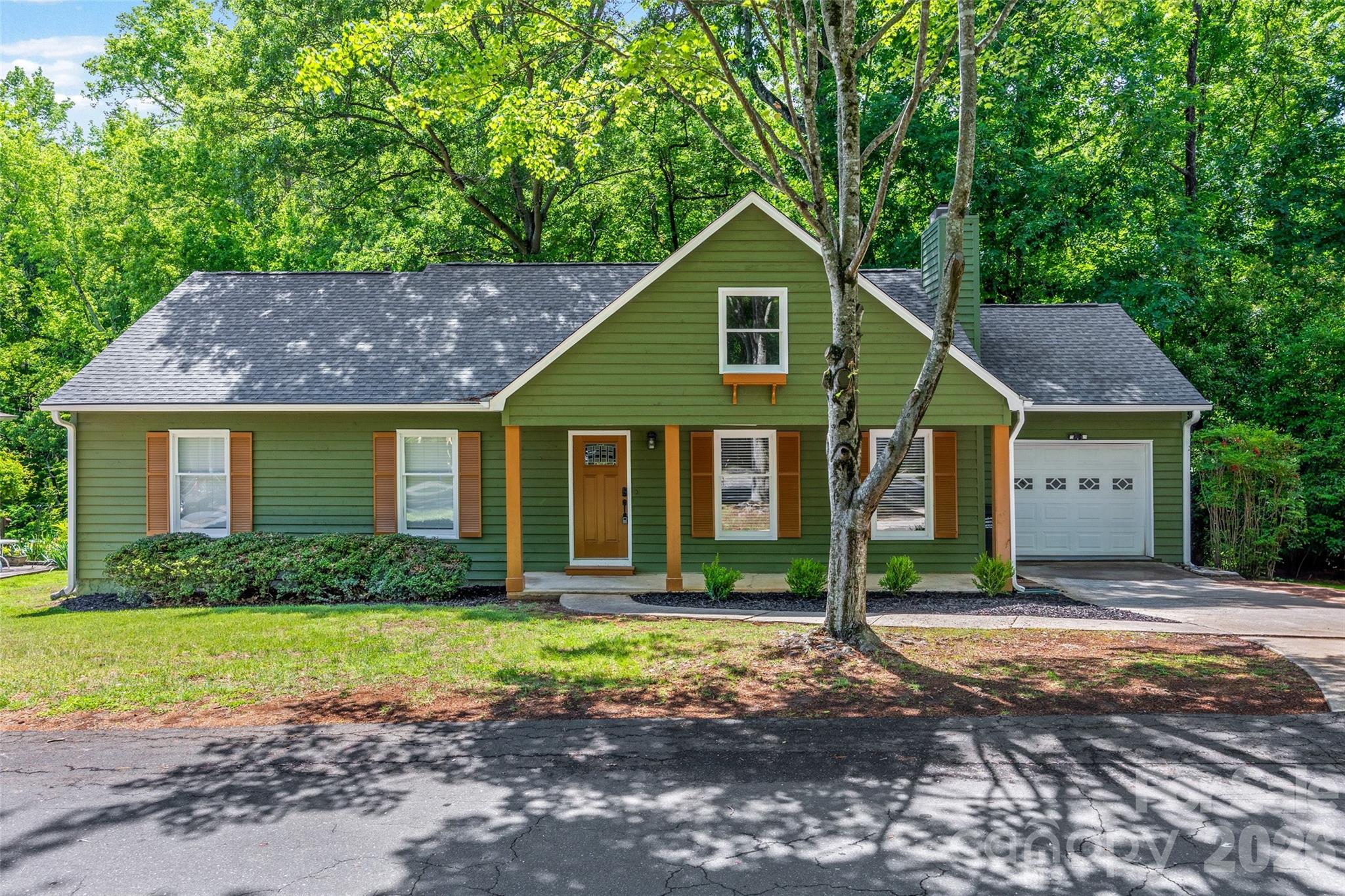 5043 Suwarrow Circle Tega Cay, SC 29708 - Photo 21 of 22 a front view of a house with garden