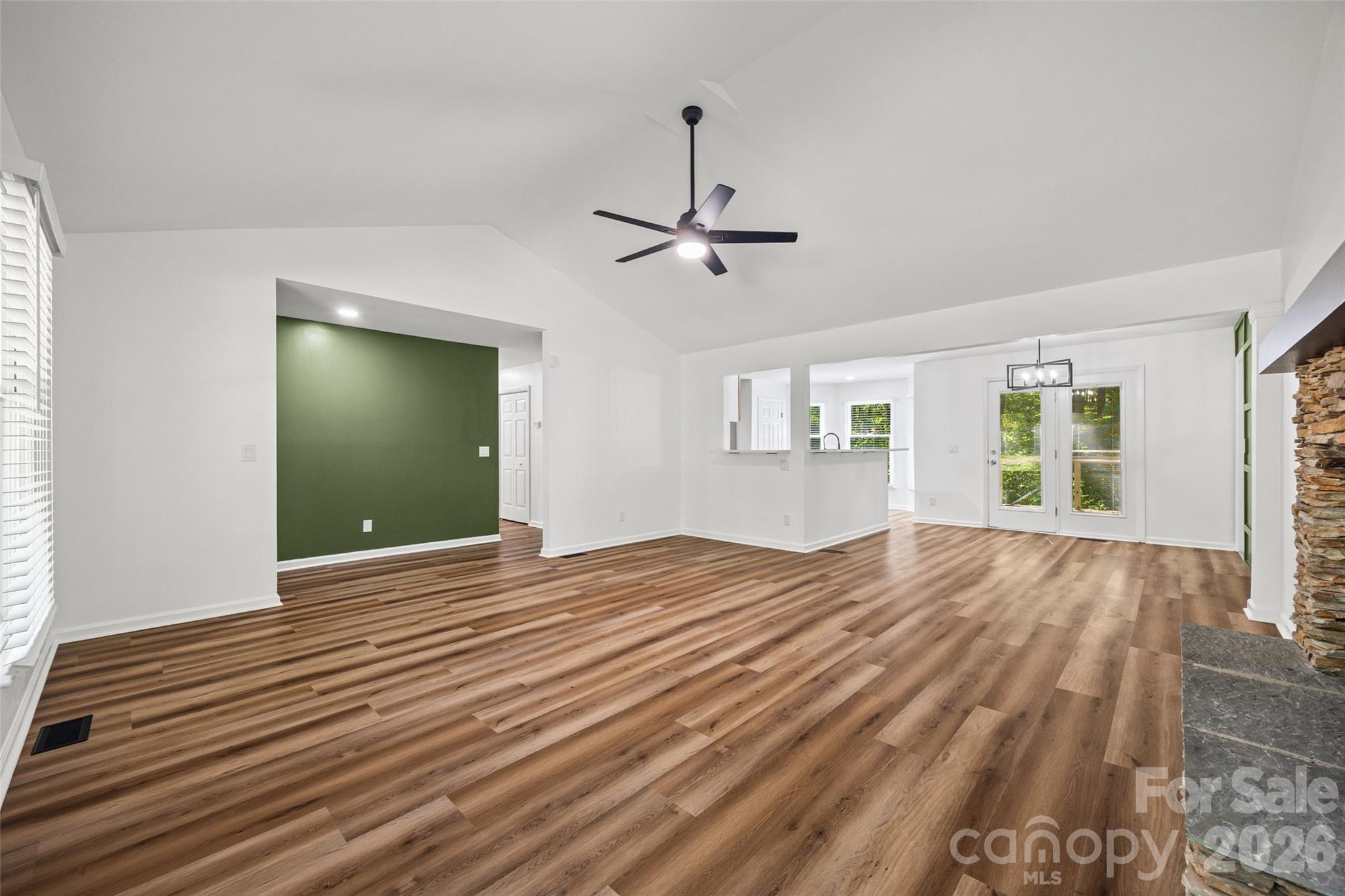 5043 Suwarrow Circle Tega Cay, SC 29708 - Photo 4 of 22 a view of empty room with wooden floor and fan
