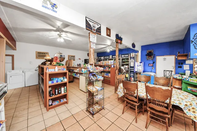 a room with furniture a flat screen tv and a table