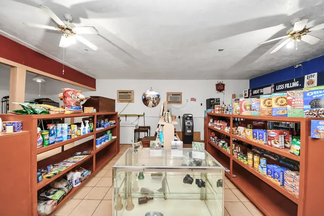 a living room with lots of furniture and a wooden floor