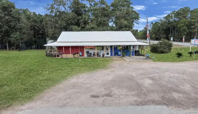 front view of a house with a yard and trees