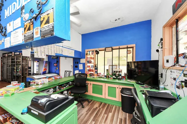 a kitchen with stainless steel appliances granite countertop a refrigerator and a stove