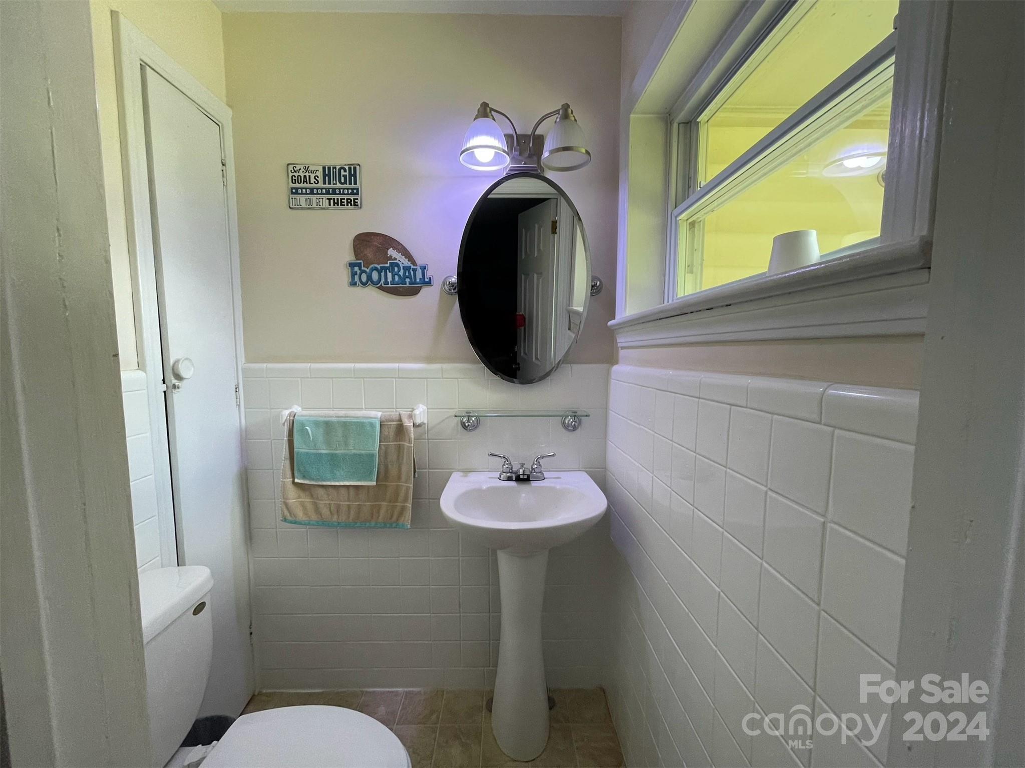 2433 Poors Ford Road Rutherfordton, NC 28139 - Photo 18 of 37 a bathroom with a sink and a mirror