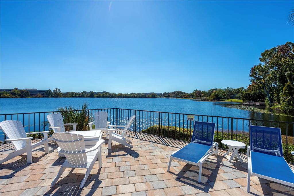 902 Lake Destiny Road, Unit C Altamonte Springs, FL 32714 - Photo 13 of 24 a view of a patio with couches chairs and wooden floor