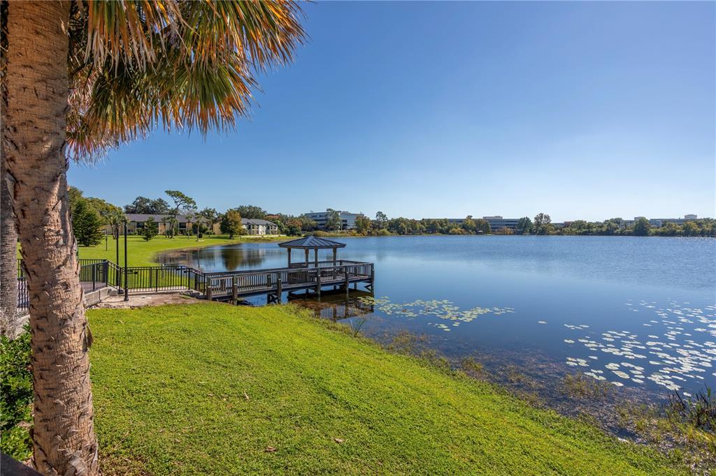 902 Lake Destiny Road, Unit C Altamonte Springs, FL 32714 - Photo 15 of 24 a view of a lake with houses in the back