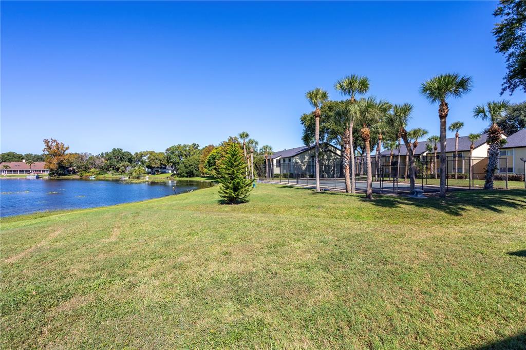 902 Lake Destiny Road, Unit C Altamonte Springs, FL 32714 - Photo 18 of 24 a view of a garden with a building in the background
