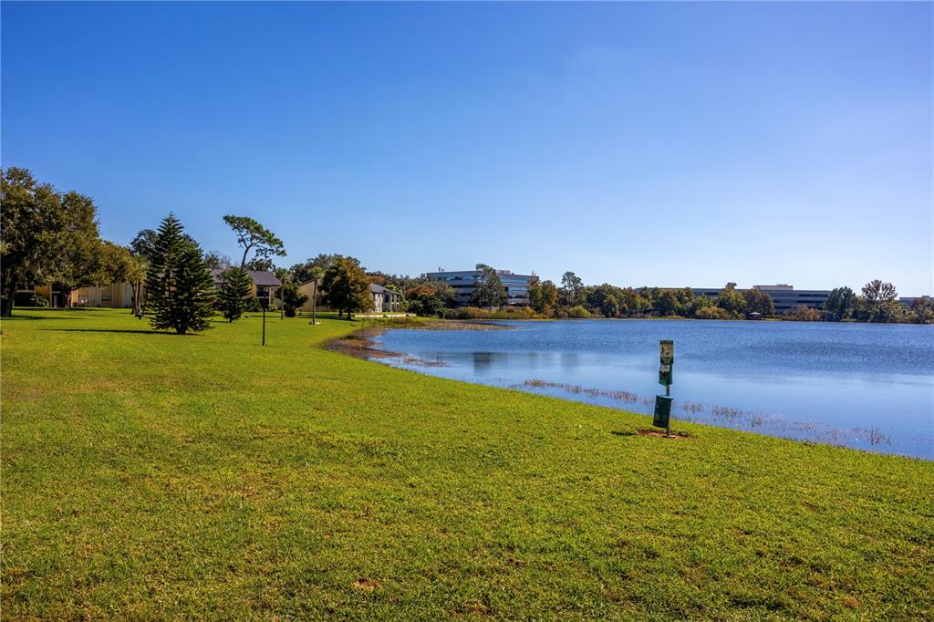 902 Lake Destiny Road, Unit C Altamonte Springs, FL 32714 - Photo 22 of 24 a view of a lake with houses in the background