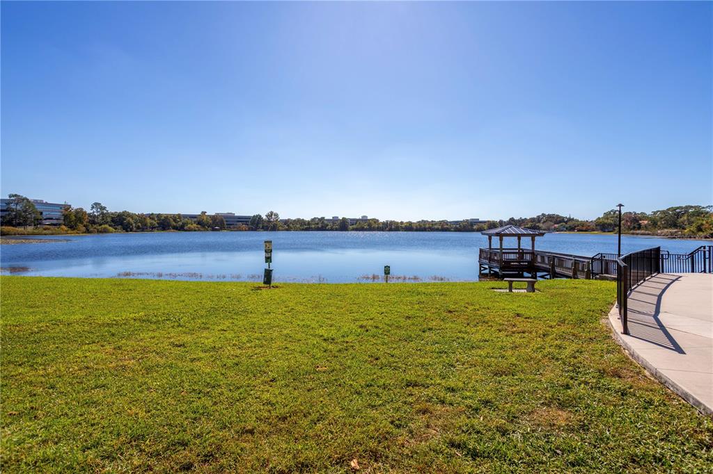 902 Lake Destiny Road, Unit C Altamonte Springs, FL 32714 - Photo 23 of 24 a view of a lake with houses in the back