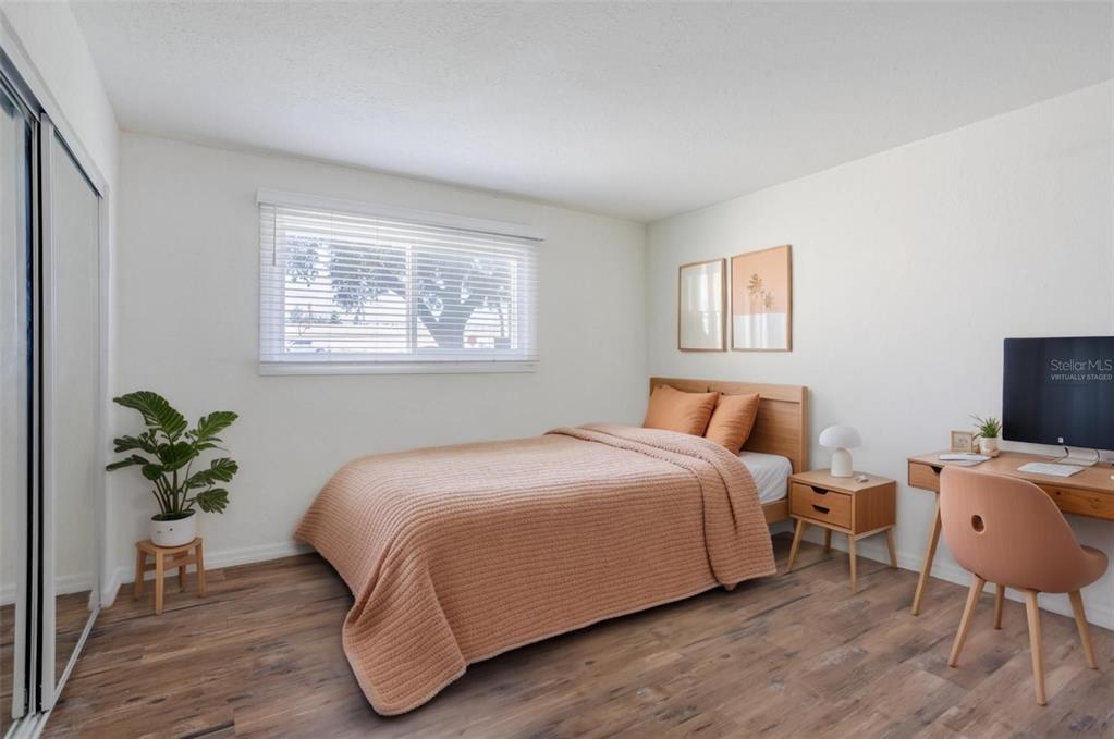 902 Lake Destiny Road, Unit C Altamonte Springs, FL 32714 - Photo 10 of 24 a bedroom with a bed and a potted plant