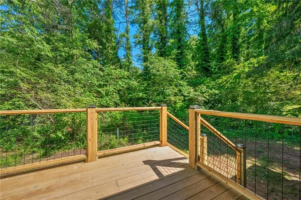 a view of balcony with deck and wooden floor