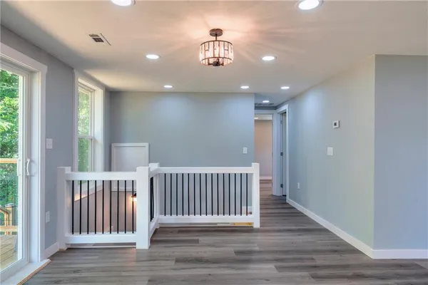 a view of entryway with stairs and wooden floor
