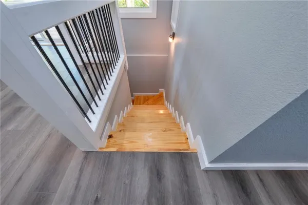 wooden floor with staircase
