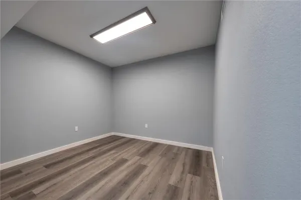 a spacious bathroom with a toilet sink and a shower