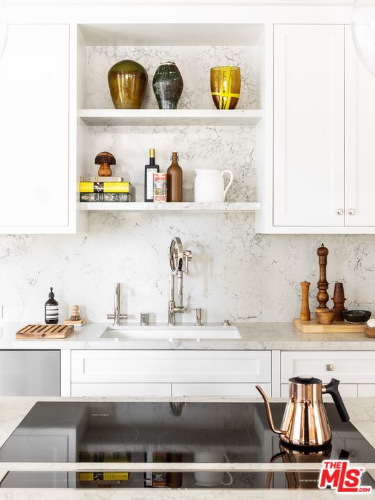 929 Marco Place Venice, CA 90291 - Photo 14 of 38 a kitchen with a refrigerator and a stove
