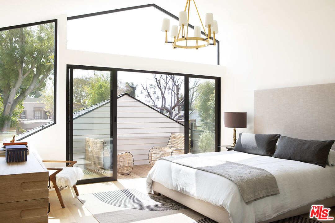 929 Marco Place Venice, CA 90291 - Photo 17 of 38 a bedroom with a bed window and balcony