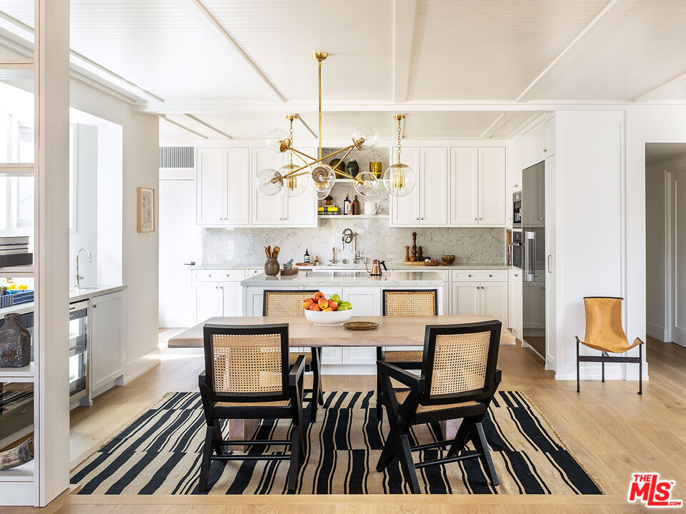 929 Marco Place Venice, CA 90291 - Photo 2 of 38 a dining room with stainless steel appliances kitchen island granite countertop furniture and a kitchen view