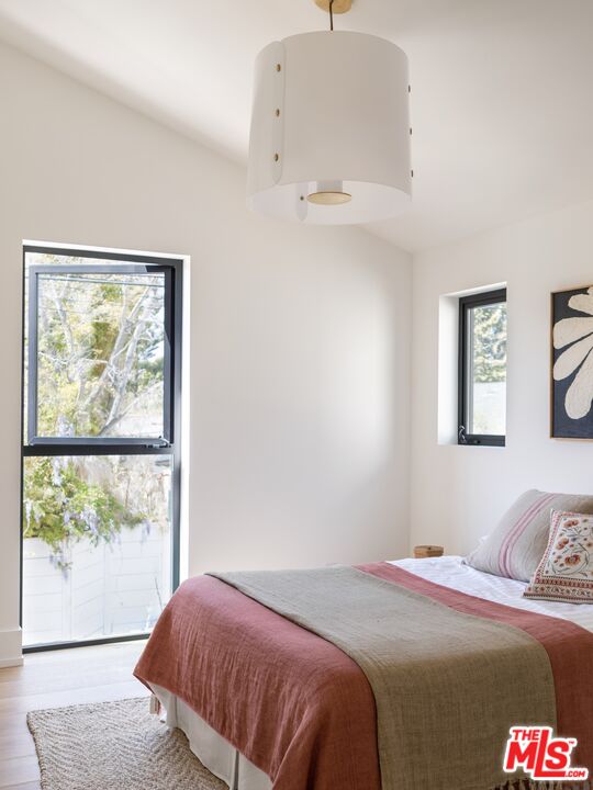 929 Marco Place Venice, CA 90291 - Photo 24 of 38 a bedroom with a bed and a window