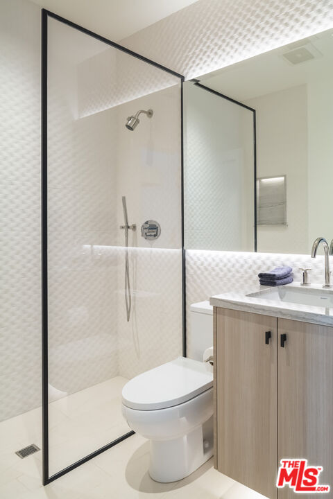 929 Marco Place Venice, CA 90291 - Photo 25 of 38 a bathroom with a granite countertop sink toilet and shower