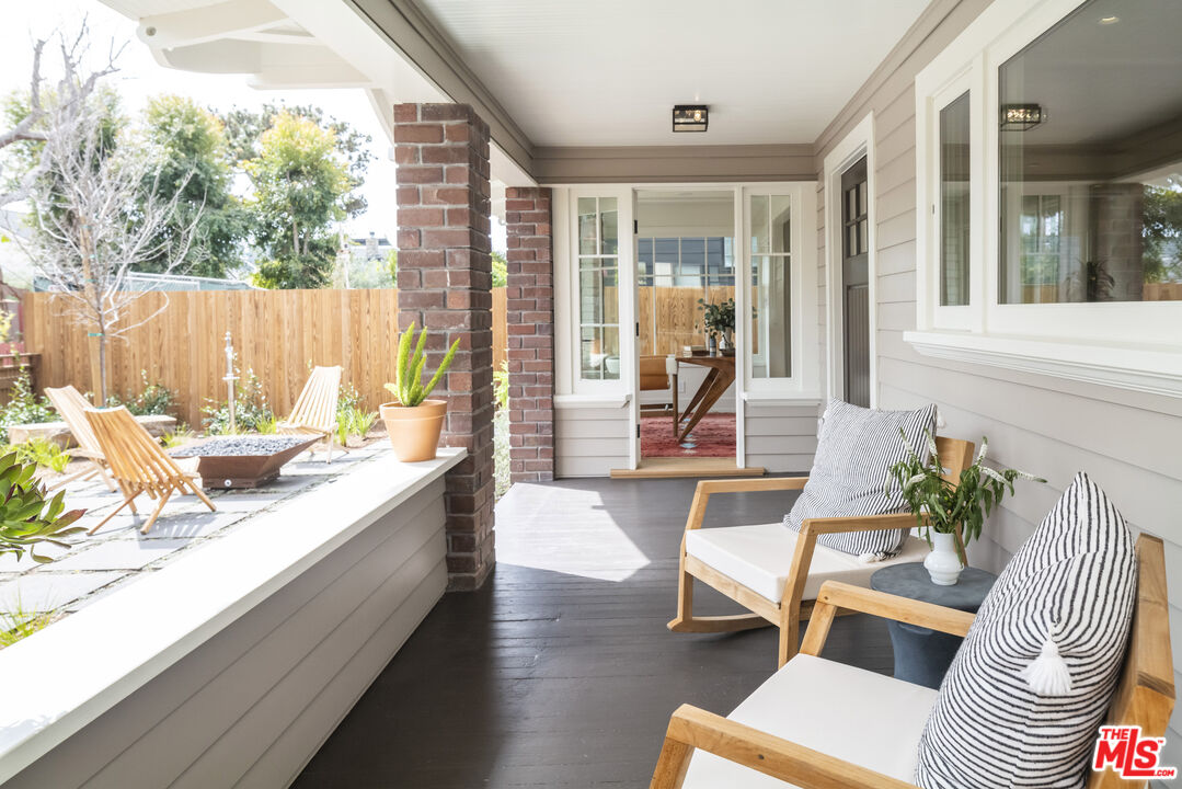 929 Marco Place Venice, CA 90291 - Photo 3 of 38 a living room with furniture and a large window