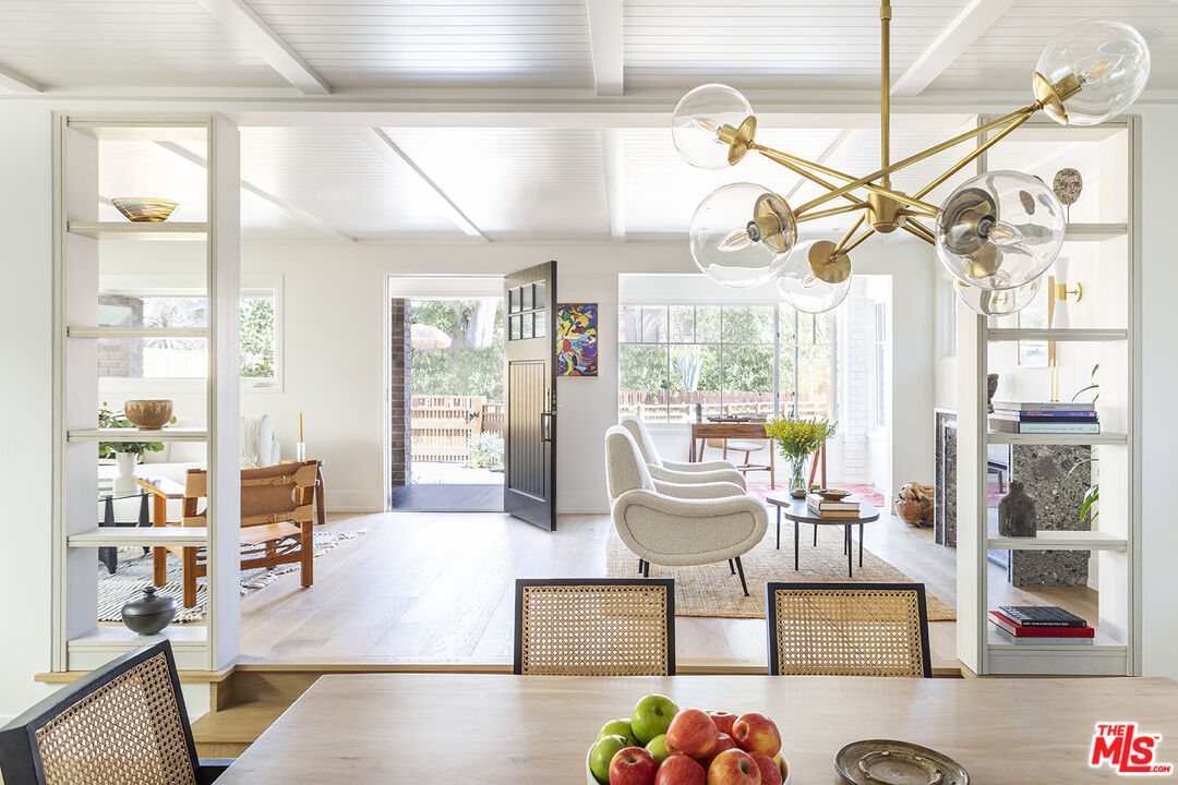 929 Marco Place Venice, CA 90291 - Photo 5 of 38 a living room with fireplace furniture and a chandelier