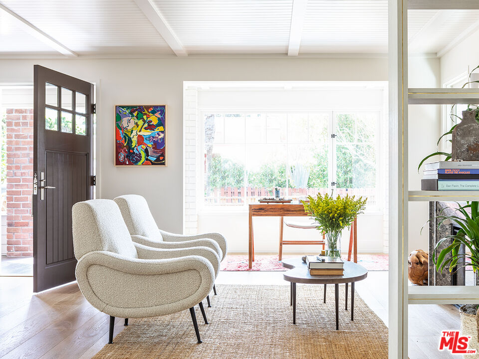 929 Marco Place Venice, CA 90291 - Photo 6 of 38 a living room with furniture and a large window