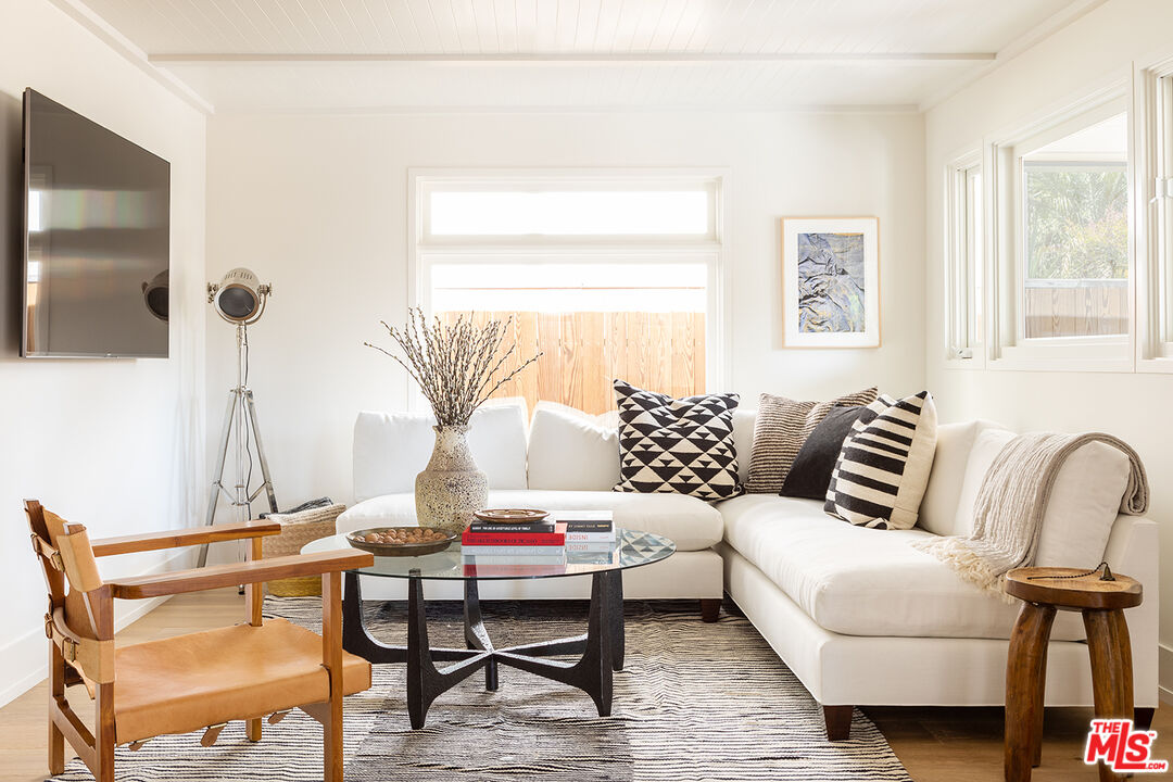 929 Marco Place Venice, CA 90291 - Photo 9 of 38 a living room with furniture and a flat screen tv