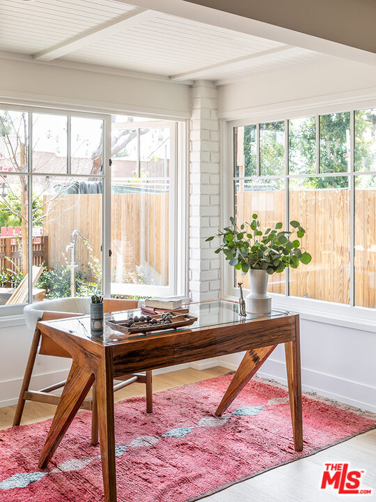 929 Marco Place Venice, CA 90291 - Photo 10 of 38 a living room filled with furniture and a potted plant